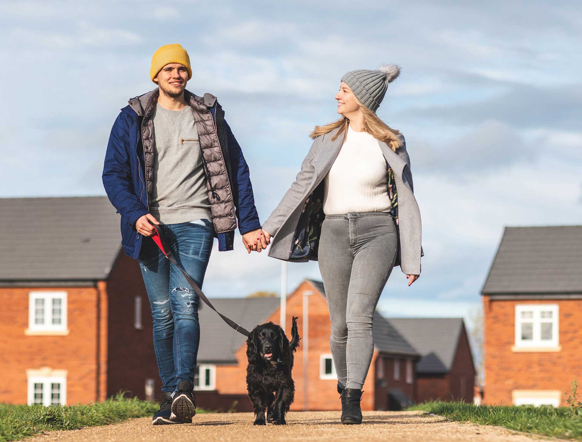 Couple walking a dog
